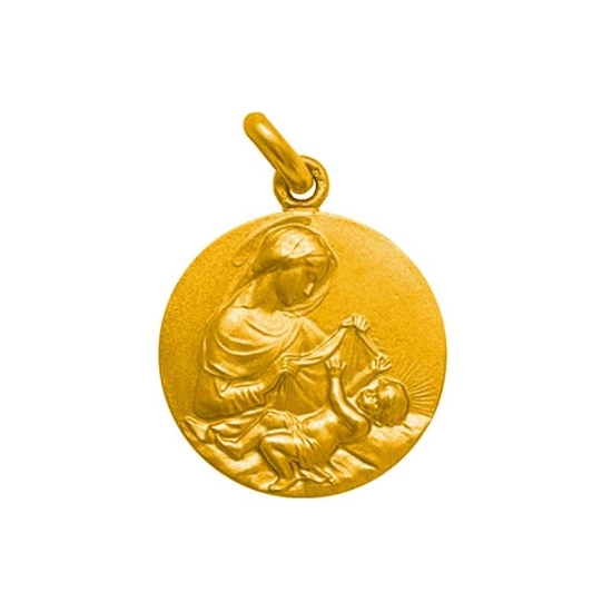 Medalla de oro con la imagen de Virgen con el Niño en la cuna.