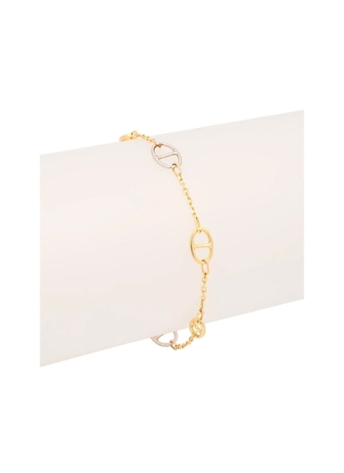 Pulsera realizada en oro bicolor, blanco y amarillo de 18Kt con eslabones grandes unidos por una fina cadena.