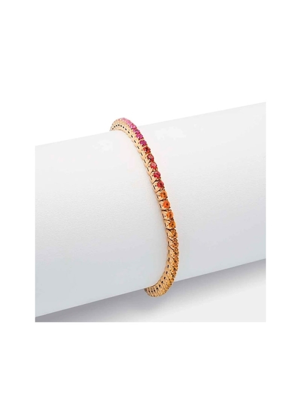 Pulsera de oro amarillo de 18Kt,elástica, mediante un hilo interior de titanio. Lleva engastados en garras, zafiros redondos de 