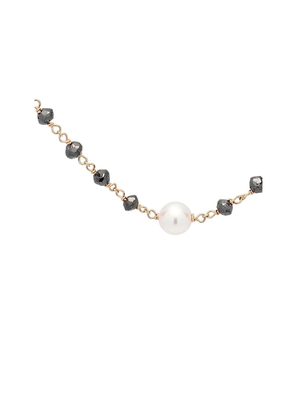 Cadena de oro rosa de 18Kt y 45cm de largo, que lleva entorchada en ella 63 rondelles de diamante negro, con un peso total de 9,