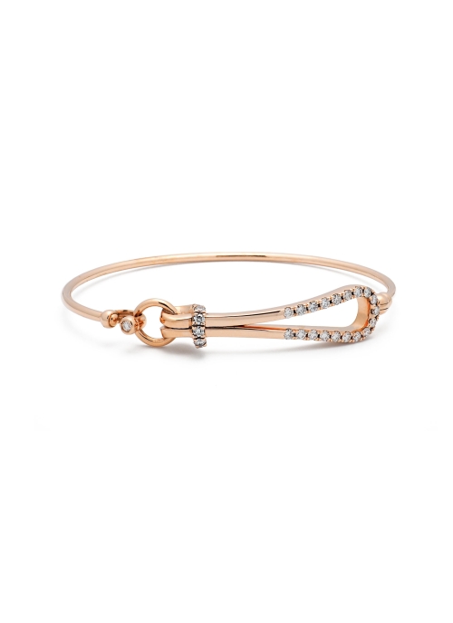 Pulsera de oro rosa de 18Kt, con una forma de gota dispuesta horizontalmente, con diamantes talla brillante. Peso total de los b