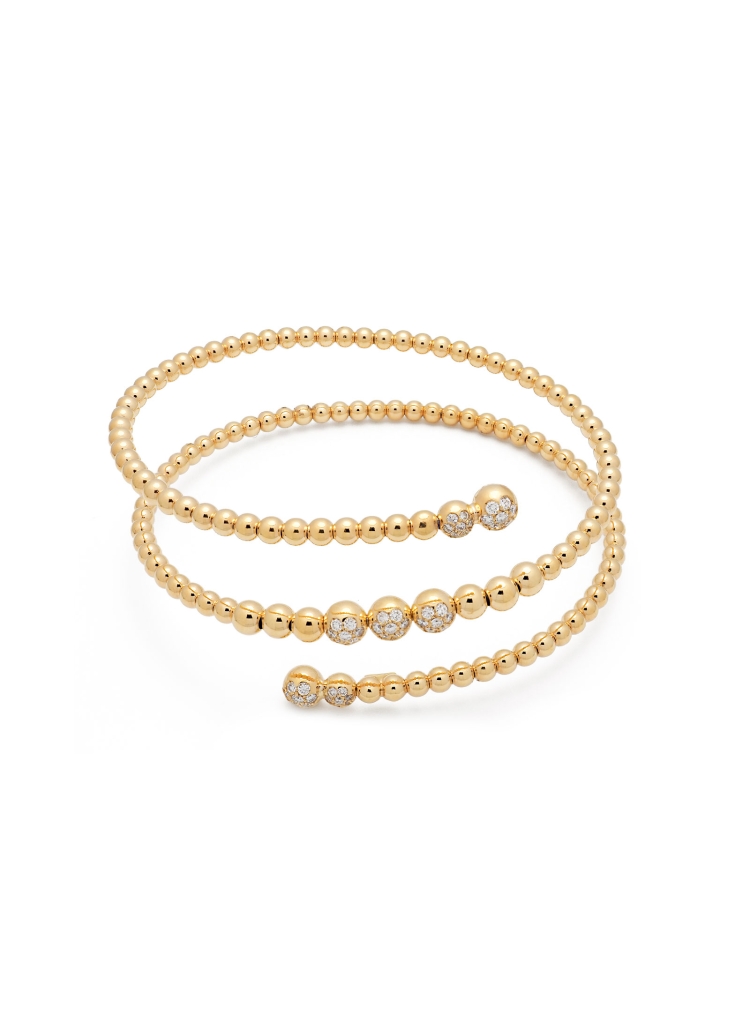 Pulsera elástica de oro amarillo de 18Kt, formado por esferas lisas 7 esferas con brillantes, con un peso total de 0,51ct y cali