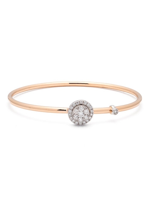 Pulsera rígida de oro rosa de 18Kt, con un motivo circular, que lleva un diamante brillante en el centro rodeado de otros 6, con
