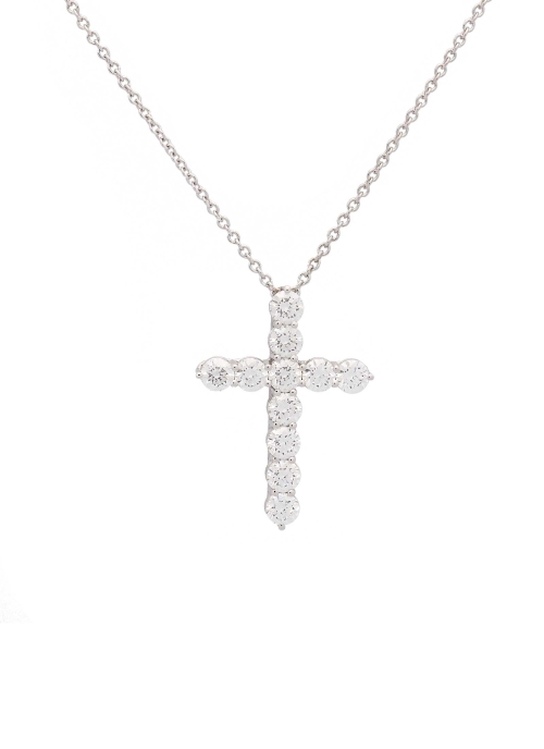 Cadena de oro blanco de 18Kt de 43cm de largo, con asa extra, permitiendo una medida de 40cm, con una cruz de oro blanco de 18Kt