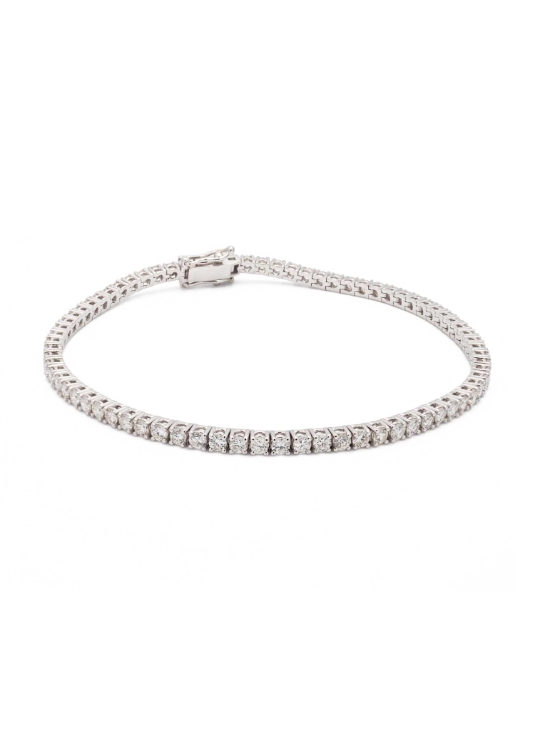 Pulsera de oro blanco de 18Kt. Riviere con 75 diamantes talla brillantes, engastados en garras, con un peso total de 3,00ct