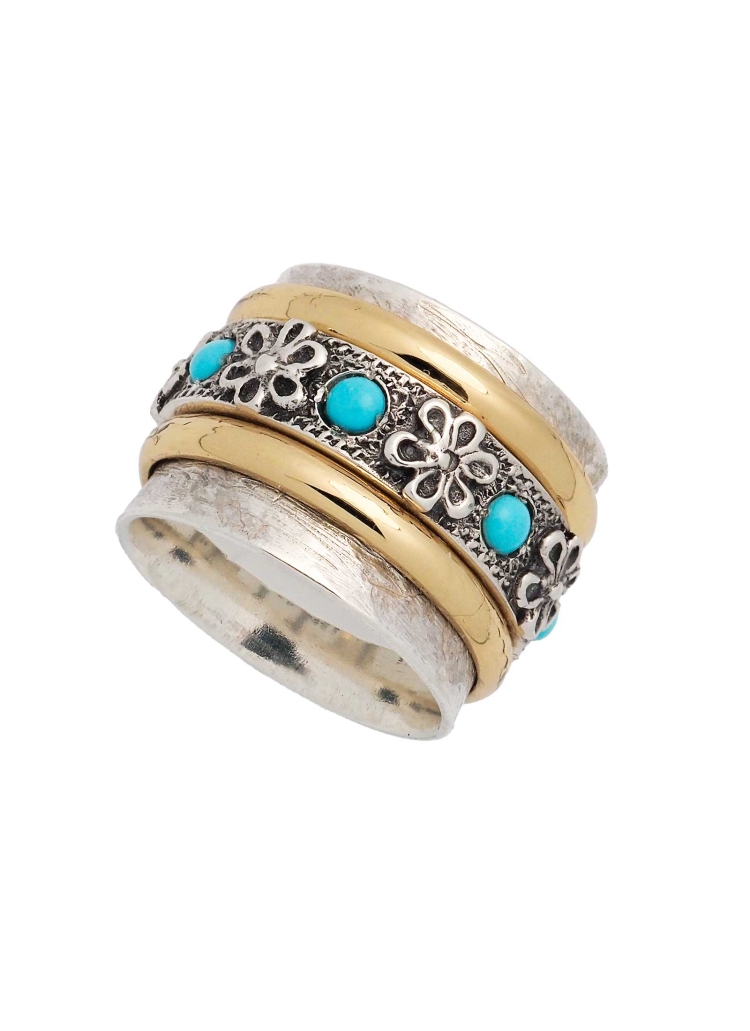 Anillo de plata de 13mm de ancho, con bordes ondulados. En el centro tienes 3 aros giratorios, uno de bronce, otro de plata y ot