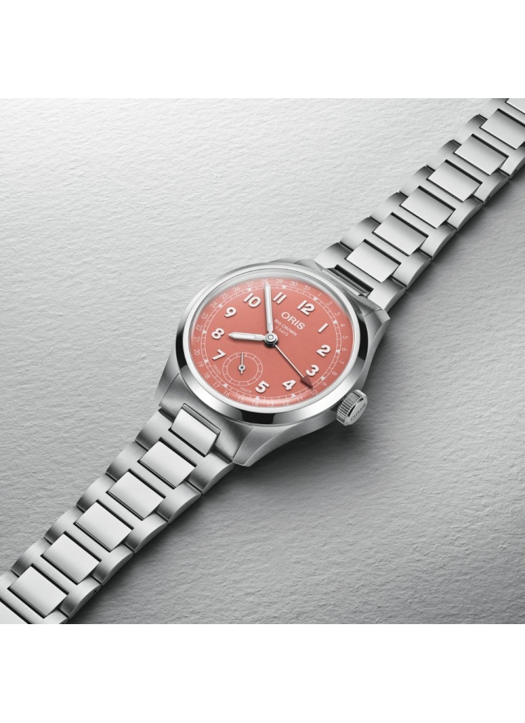 Reloj automático en caja de acero de 40mm con reserva de marcha de hasta 120h, esfera color terracota y brazalete de acero.