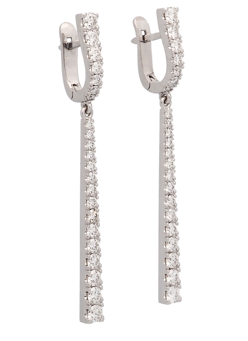 Pendientes de oro blanco de 18Kt, hechos a mano. Dormilonas de 4 garras con un diamante talla brillante de 0,60ct cada uno. Ambo