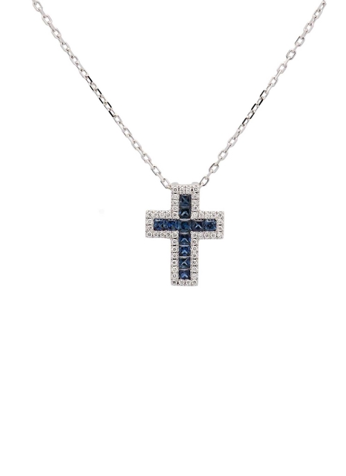 Cruz de oro blanco de 18Kt, de 12x10mm (ancho 3,60mm) con zafiros talla carré en el centro, con un peso total de 0,31ct rodeados