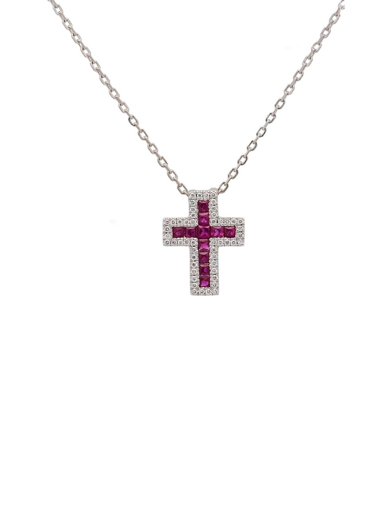 Cruz de oro blanco de 18Kt, de 12x10mm (ancho 3,60mm) con rubíes talla carré en el centro, con un peso total de 0,31ct rodeados 