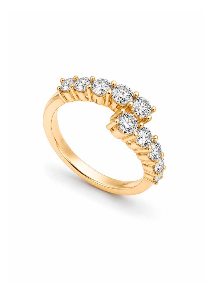 Anillo de oro amarillo de 18Kt hecho a mano. Dos bandas que se cruzan con diamantes talla brillante engastados en garras. Peso t
